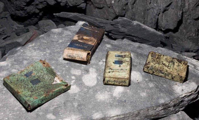 Old cigarette packets on a piece of slate